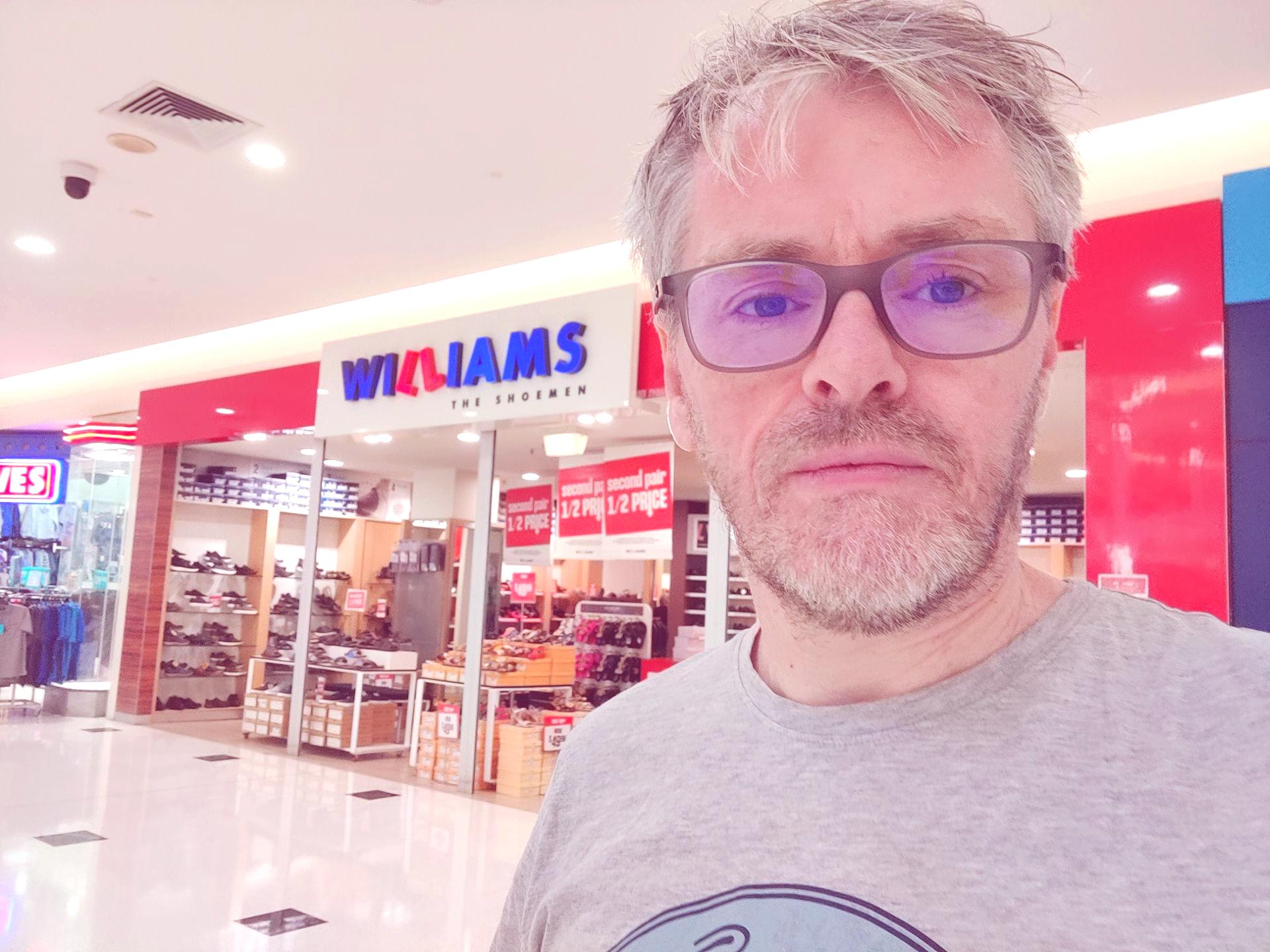photo of a man in a shopping mall