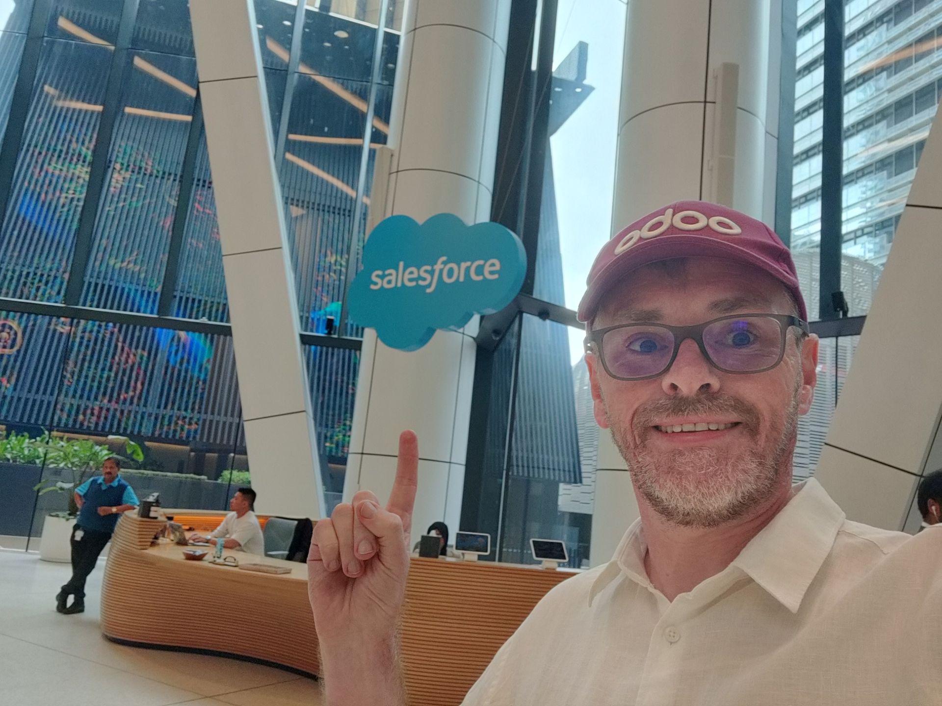 man with an Odoo hat inside the Salesforce Tower