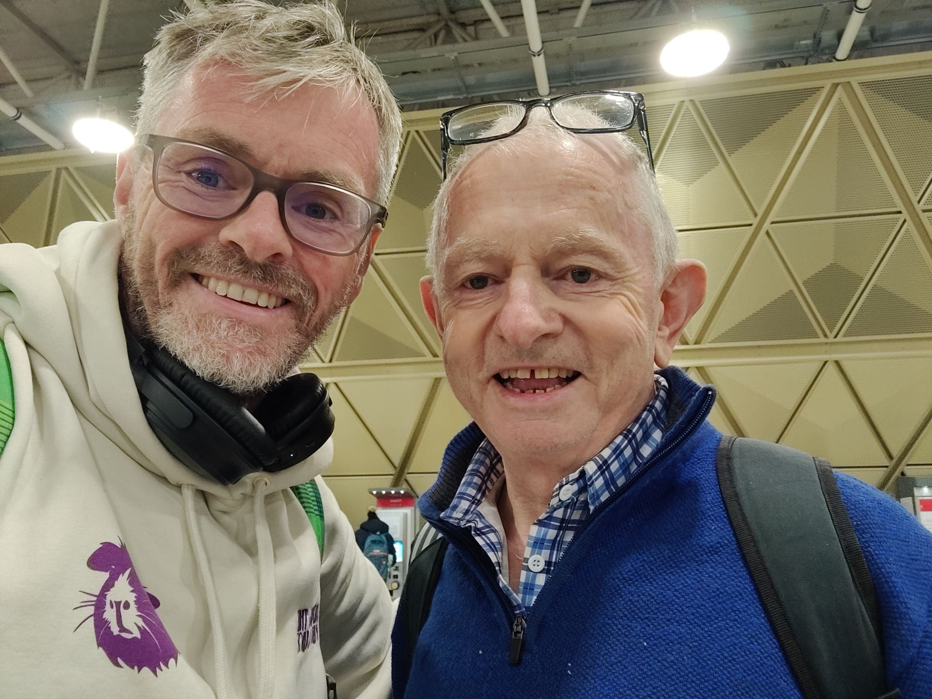 two men inside an airport